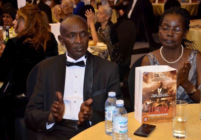 Actor Micheal Wawuyo and his wife at the film's premiere, held last Friday at Serena Hotel in Kampala.