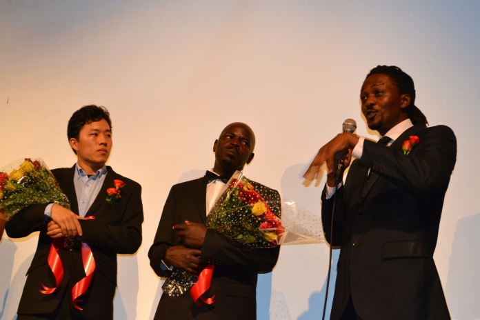 (L-R) Young Gul Kim, Carlos Ombonya and James Bagyenzi introducing their film.